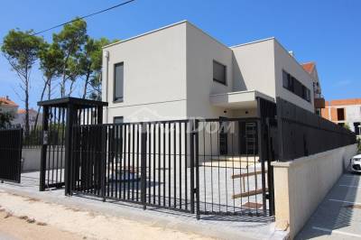 Seaside property with swimming pool and landscaped garden.