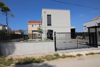 Seaside property with swimming pool and landscaped garden.