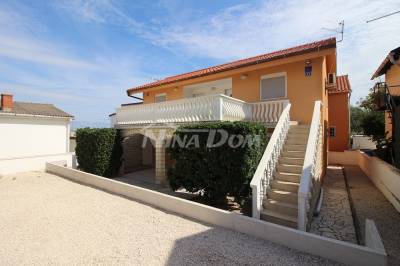 Detached property with 4 smaller residential units. 