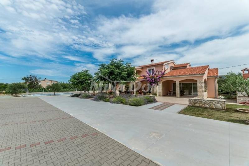 Residential and commercial building with a large garden and swimming pool - 2
