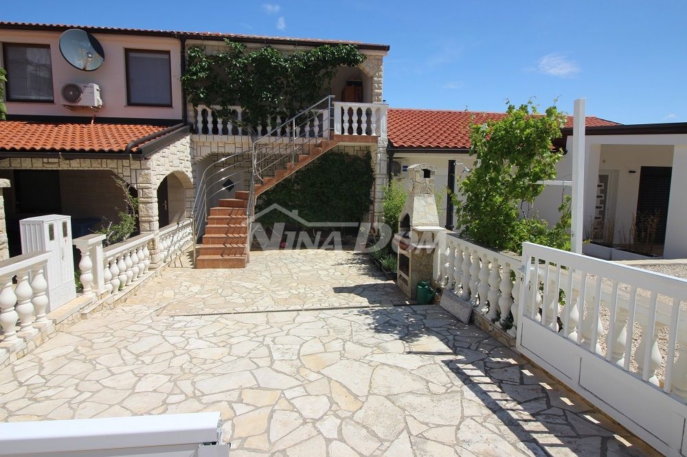 Terraced house, with two apartments, 60 meters from the sea and the beach.