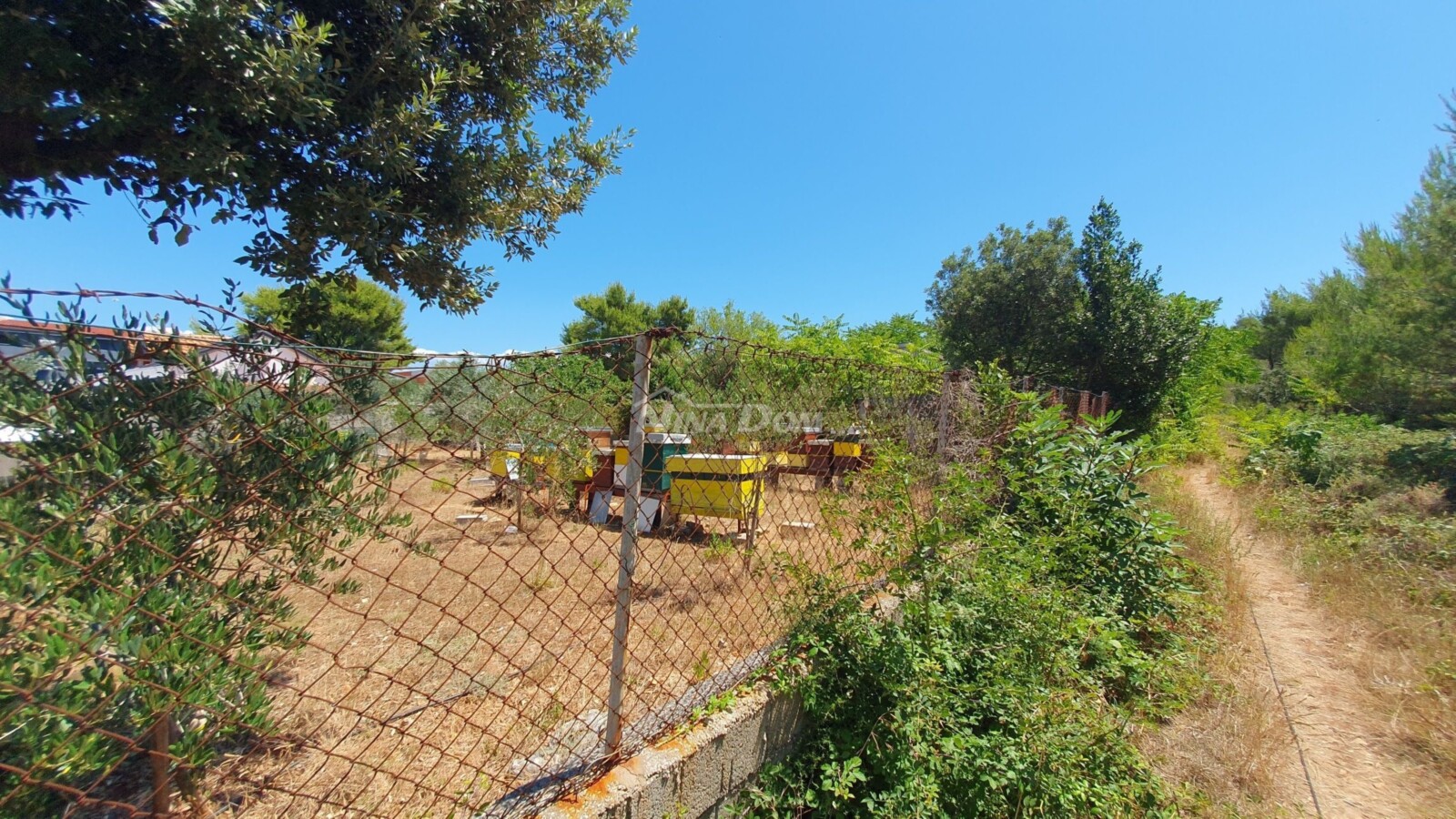 Land outside the construction zone with legalized buildings.