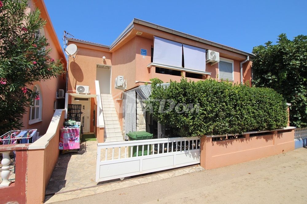 Apartment house with 4 apartments and a building plot 60 meters from the sea.